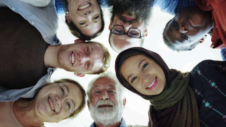 Smiling people in a circle.