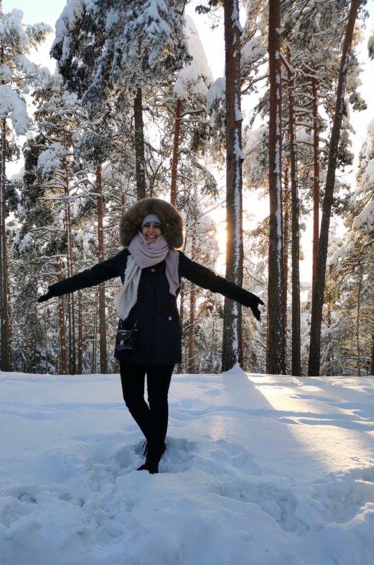 Annika Weis in a snowy forest.