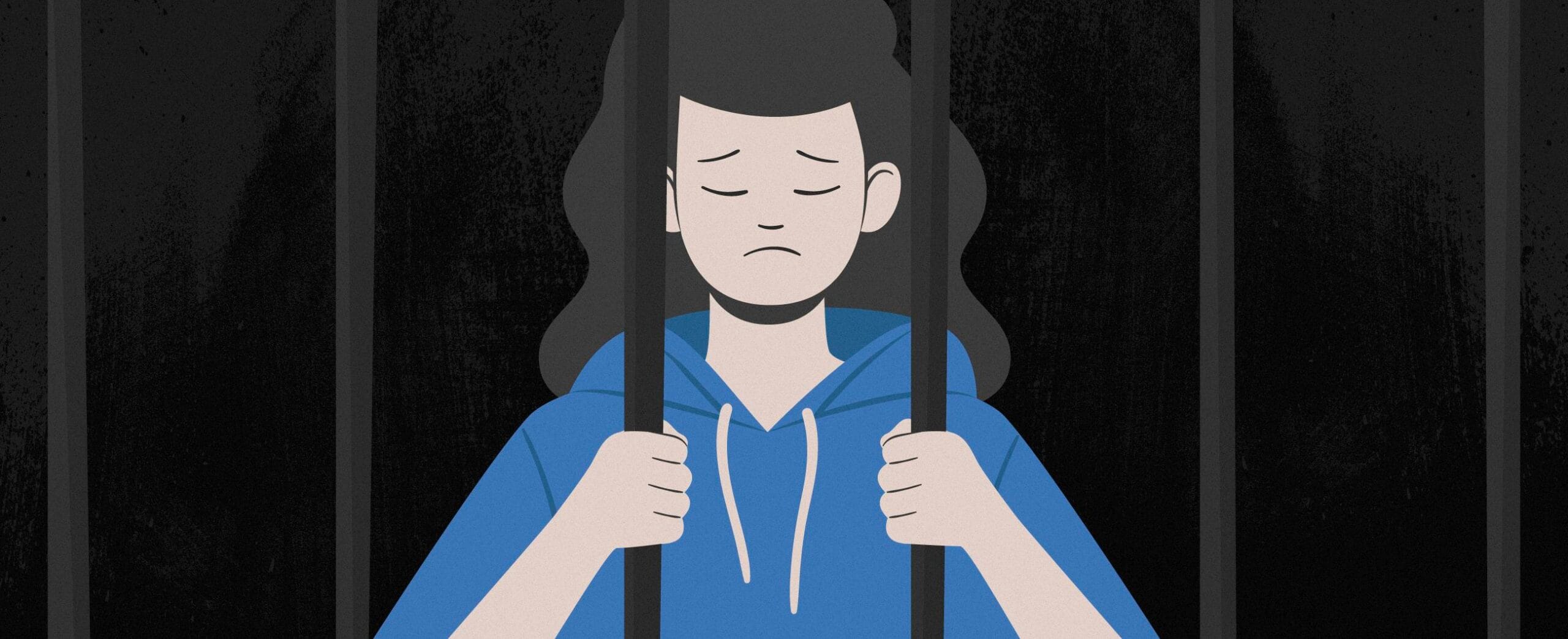 jossa surullinen tyttö kaltereiden takana.