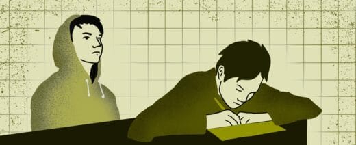 toinen kirjoittaa vihkoon