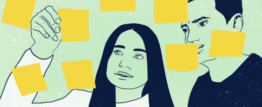 Barriers picture.Tarralappuja seinälle kiinnittävät nainen ja mies